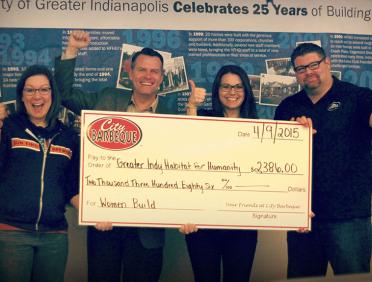 City Barbeque teammates with donation check