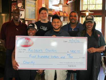 City Barbeque teammates with donation check
