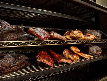 City Barbeque meats on the smoker