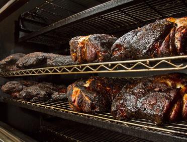 City Barbeque meats on the smoker