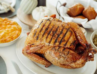 a whole smoked turkey with sides