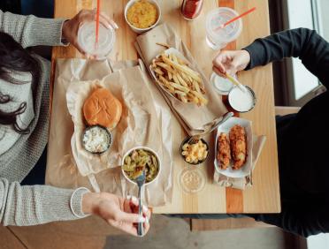 Family eating together at City Barbeque