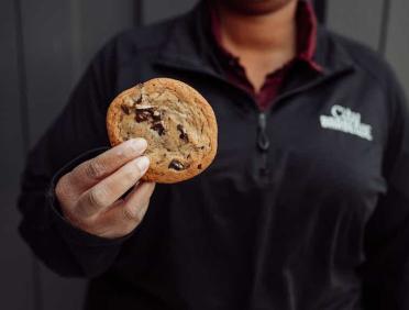 City Barbeque teammate holding a cookie