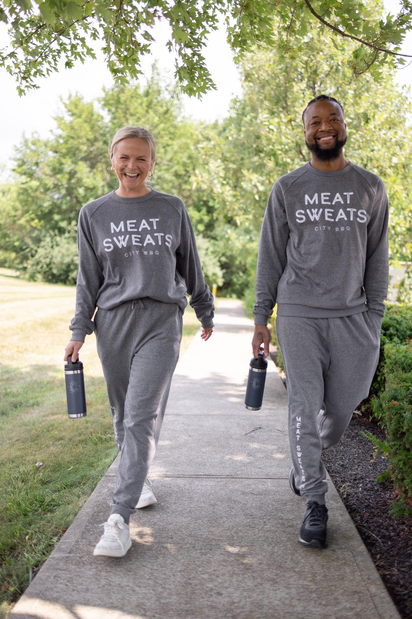 Smiling people wearing City Barbeque Meat Sweats sweatsuits